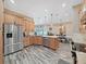 Open concept kitchen with stainless steel appliances and granite countertops at 807 Virginia Ave, Tarpon Springs, FL 34689