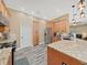 Modern kitchen with stainless steel appliances and light wood cabinets at 807 Virginia Ave, Tarpon Springs, FL 34689