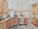 Modern kitchen with island, stainless steel appliances, and granite counters at 807 Virginia Ave, Tarpon Springs, FL 34689