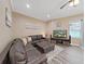 Spacious living room featuring a large sectional sofa and flat-screen TV at 807 Virginia Ave, Tarpon Springs, FL 34689
