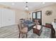 Living room featuring a cozy sitting area and wood-look floors at 807 Virginia Ave, Tarpon Springs, FL 34689