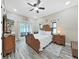 Main bedroom with king-size bed and access to the patio at 807 Virginia Ave, Tarpon Springs, FL 34689