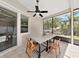 Relaxing screened patio with granite table and chairs, perfect for outdoor dining at 807 Virginia Ave, Tarpon Springs, FL 34689