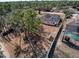 Aerial view showing house, fenced backyard, and pool at 8284 Cockatoo Rd, Weeki Wachee, FL 34613