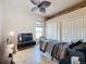 Bedroom with bed, closet and ceiling fan at 8284 Cockatoo Rd, Weeki Wachee, FL 34613