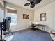 Bedroom with desk, window, and ceiling fan at 8284 Cockatoo Rd, Weeki Wachee, FL 34613