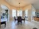 Bright breakfast nook with table and chairs, offering view to pool at 8284 Cockatoo Rd, Weeki Wachee, FL 34613