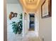 Bright hallway with tile flooring and access to other rooms at 8284 Cockatoo Rd, Weeki Wachee, FL 34613