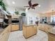 Modern kitchen with granite counters, stainless steel appliances, and large island at 8284 Cockatoo Rd, Weeki Wachee, FL 34613
