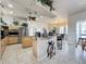 Eat-in kitchen with island, granite counters, and stainless steel appliances at 8284 Cockatoo Rd, Weeki Wachee, FL 34613