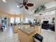 Open concept kitchen with island, granite countertops, and stainless steel appliances at 8284 Cockatoo Rd, Weeki Wachee, FL 34613