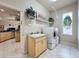 Bright laundry room with washer, dryer, and utility sink at 8284 Cockatoo Rd, Weeki Wachee, FL 34613