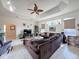 Relaxing living room with sectional sofa, fireplace, and large windows at 8284 Cockatoo Rd, Weeki Wachee, FL 34613