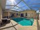 Relaxing pool area with covered patio and seating at 8284 Cockatoo Rd, Weeki Wachee, FL 34613