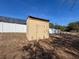 Tan storage shed in the backyard at 8284 Cockatoo Rd, Weeki Wachee, FL 34613