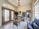 Bright sunroom with comfortable seating and access to the outdoors at 8284 Cockatoo Rd, Weeki Wachee, FL 34613