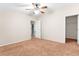 Bright bedroom with ceiling fan and closet; view of bathroom at 8420 Fantasia Park Way, Riverview, FL 33578