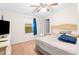 Relaxing bedroom with a king-size bed and large TV at 8420 Fantasia Park Way, Riverview, FL 33578