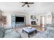 Cozy living room with fireplace, built-in entertainment center and hardwood floors at 8420 Fantasia Park Way, Riverview, FL 33578