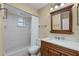 Updated bathroom with a vanity and shower/tub combo at 905 Palm Blvd, Dunedin, FL 34698