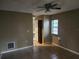 Simple bedroom with tile floor and ceiling fan at 9179 Gillmar St, Spring Hill, FL 34608