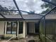 House exterior with pool and screen enclosure at 9179 Gillmar St, Spring Hill, FL 34608