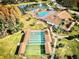 Aerial view showing clubhouse, pool, and shuffleboard courts at 9240 Tiara Ct, New Port Richey, FL 34655