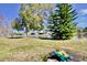Landscaped backyard with lake view and a charming garden at 9240 Tiara Ct, New Port Richey, FL 34655