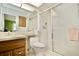 Bathroom with shower and wood vanity at 9240 Tiara Ct, New Port Richey, FL 34655
