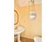 Powder room with pedestal sink and toilet at 9240 Tiara Ct, New Port Richey, FL 34655