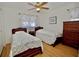 Guest bedroom with twin beds, wood floors and dresser at 9240 Tiara Ct, New Port Richey, FL 34655