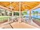 Relaxing gazebo with lake views, ceiling fans, and seating for multiple guests at 9240 Tiara Ct, New Port Richey, FL 34655