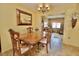Elegant dining room with a formal table setting and a view to the living room at 9240 Tiara Ct, New Port Richey, FL 34655
