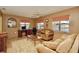 Gathering room with lake view and comfortable seating at 9240 Tiara Ct, New Port Richey, FL 34655