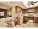 Kitchen features stainless steel appliances and a breakfast bar at 9240 Tiara Ct, New Port Richey, FL 34655