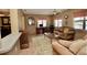 Cozy living room featuring comfortable seating, a coffee table, and a home office space at 9240 Tiara Ct, New Port Richey, FL 34655