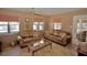 Sunroom with two couches and a glass top coffee table at 9240 Tiara Ct, New Port Richey, FL 34655