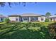 Home features a large backyard with a screened patio at 9694 Southern Belle Dr, Weeki Wachee, FL 34613