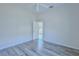 Bedroom with ceiling fan, wood-look floors and door to patio at 9694 Southern Belle Dr, Weeki Wachee, FL 34613
