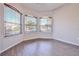 Bright bedroom with wood-look floors and arched windows at 9694 Southern Belle Dr, Weeki Wachee, FL 34613