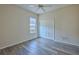 Bedroom with ceiling fan, wood-look floors, and sliding door at 9694 Southern Belle Dr, Weeki Wachee, FL 34613