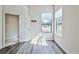 Sunny bedroom with wood-look floors and two windows at 9694 Southern Belle Dr, Weeki Wachee, FL 34613