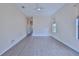 Spacious bedroom with hardwood floors and an adjacent hallway at 9694 Southern Belle Dr, Weeki Wachee, FL 34613