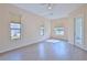 Bright bedroom with hardwood floors and access to a patio at 9694 Southern Belle Dr, Weeki Wachee, FL 34613