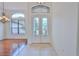 Bright and airy entryway with hardwood floors and a chandelier at 9694 Southern Belle Dr, Weeki Wachee, FL 34613
