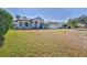 House with a large front yard at 9694 Southern Belle Dr, Weeki Wachee, FL 34613