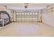 Spacious two-car garage with overhead storage at 9694 Southern Belle Dr, Weeki Wachee, FL 34613