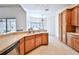 Spacious kitchen featuring ample cabinetry and a large island at 9694 Southern Belle Dr, Weeki Wachee, FL 34613