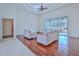 Spacious living area featuring hardwood floors and access to a patio at 9694 Southern Belle Dr, Weeki Wachee, FL 34613