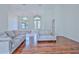 Living room with hardwood floors and view of entryway at 9694 Southern Belle Dr, Weeki Wachee, FL 34613